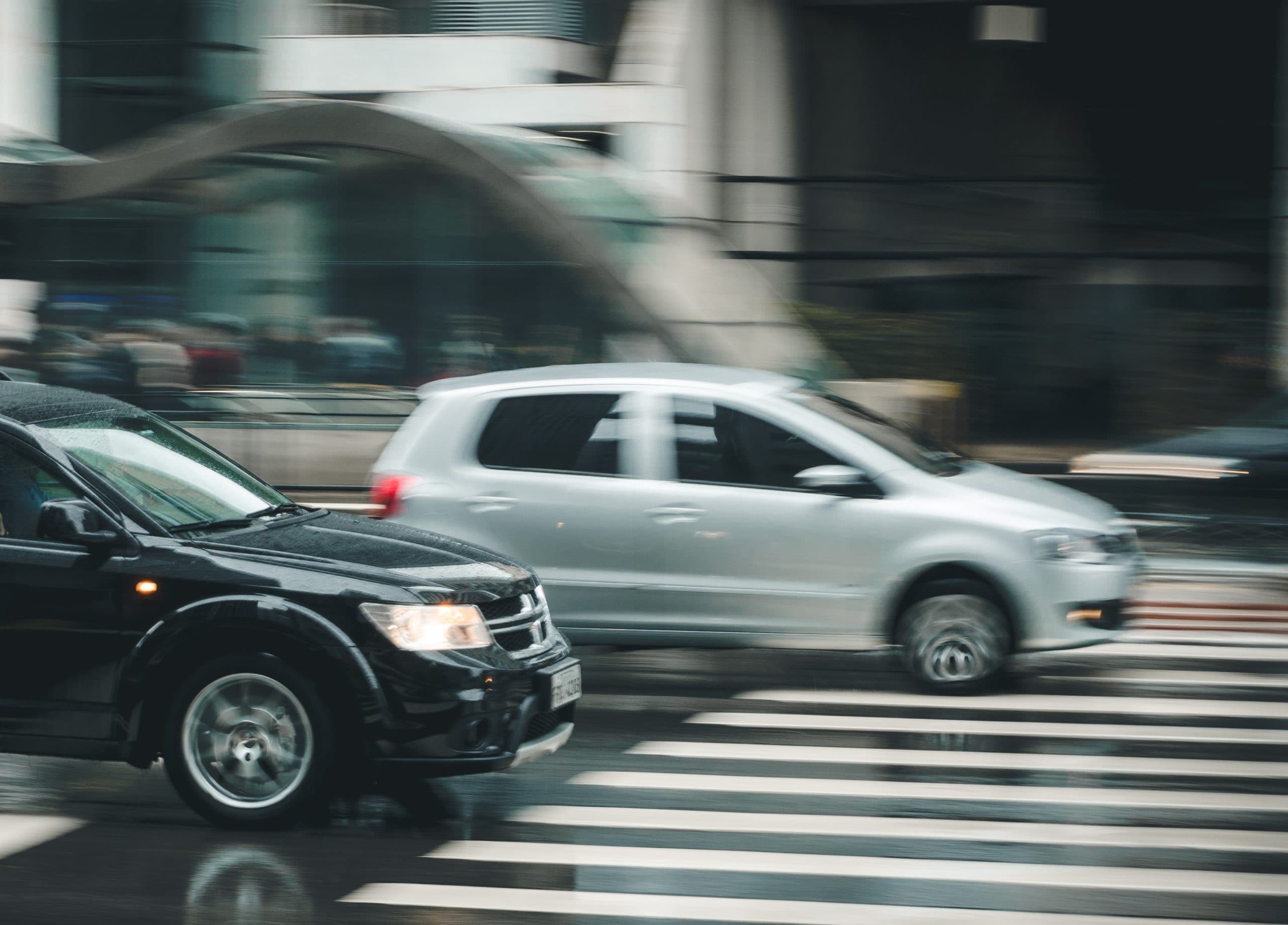 black-suv-beside-grey-auv-crossing-the-pedestrian-line-125514-scaled