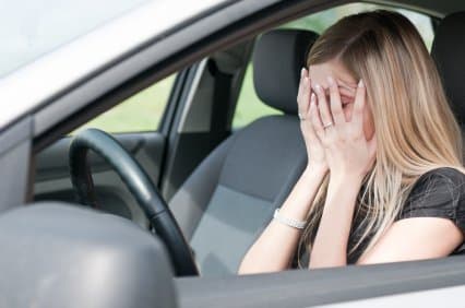 In troubles – unhappy woman in car